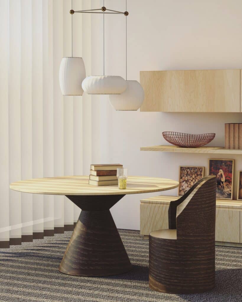 Salle à Manger Moderne: Design Bois et Luminaires Suspendus Salle à manger moderne avec table ronde en bois et chaise assortie. Trois luminaires suspendus éclairent la table. Étagères murales décorées de livres, d'un bol et d'encadrements. Stores verticaux et tapis texturé.